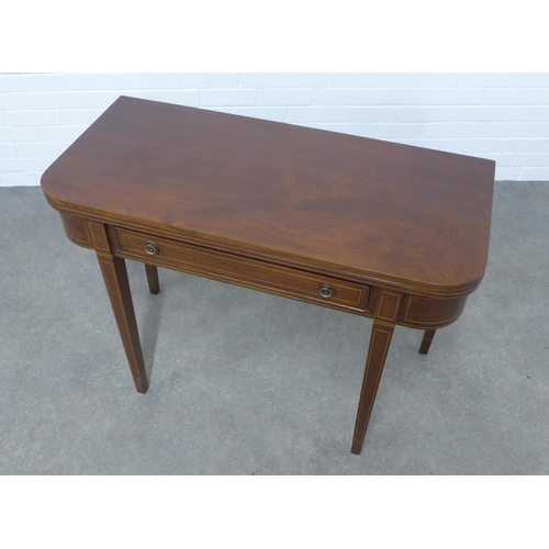 268 - Mahogany fold over table with satinwood stringing, single frieze drawer,  on tapering legs, 102 x 75... 