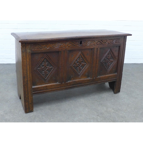 270 - An oak blanket box, plain rectangular top opening to a void interior, with carved frieze and triple ... 