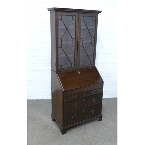 273 - Mahogany bureau bookcase , dentil cornice over a pair of astragal glazed doors with a shelved interi... 