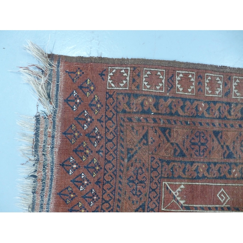 281 - Eastern rug, worn red field with geometric motifs, 262 x 172cm.