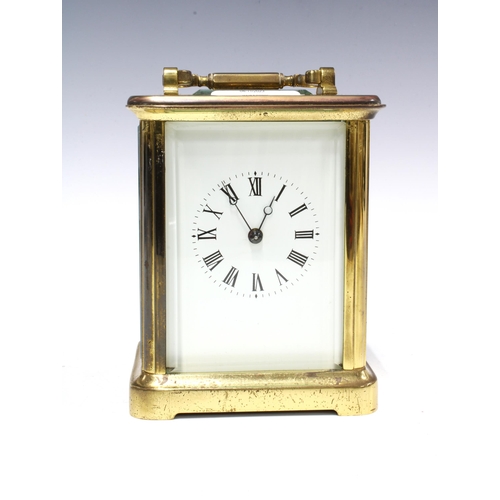 300 - Brass and glass cased carriage clock of large proportions, 18cm high including handle