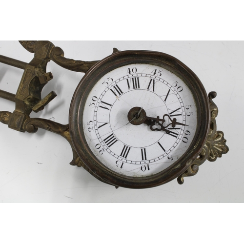 301 - Mystery clock movement, gilt metal with circular enamel dial having roman and Arabic numerals, 35cm ... 