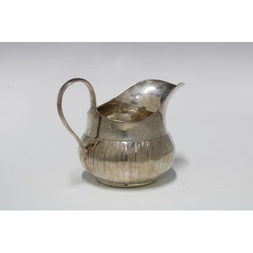 31 - George III Irish silver cream jug, with fluted base, Dublin 1760, 9cm high