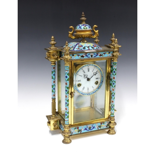 318 - Cloisonne, brass and glass cased mantle clock, surmounted by an urn finial, enamel dial with roman n... 