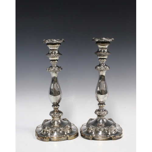 81 - A pair of silver plated knop stem candlesticks, circular weighted bases (2) 29cm high.