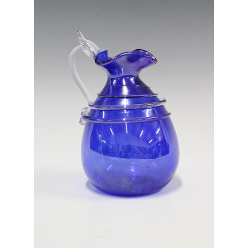 85 - Murano blue glass jug with clear glass trail and handle, 17cm.