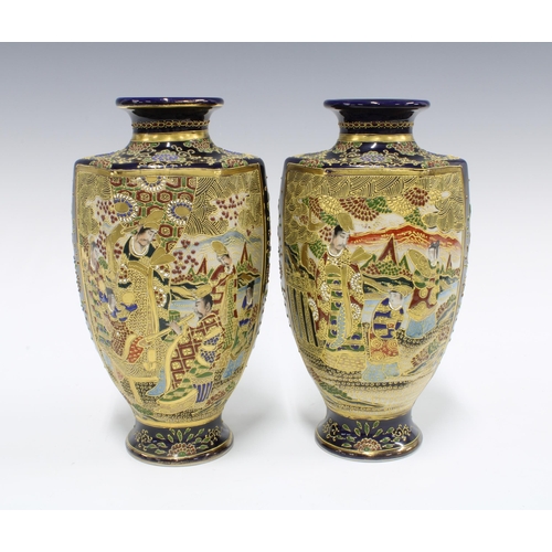 129 - A pair of Japanese earthenware Satsuma style baluster vases (2) 25cm.