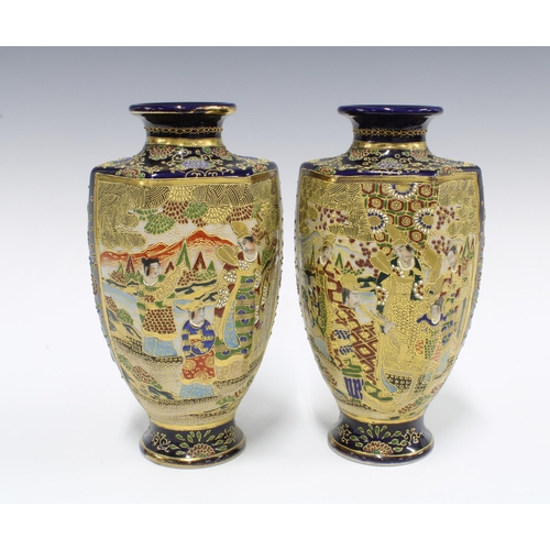 129 - A pair of Japanese earthenware Satsuma style baluster vases (2) 25cm.