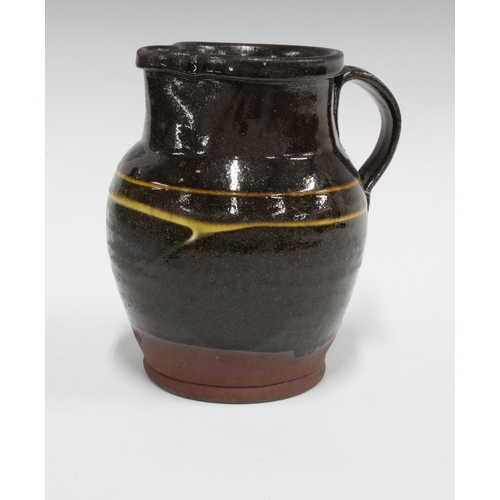 139 - Art pottery slipware jug, 18 x 17cm.