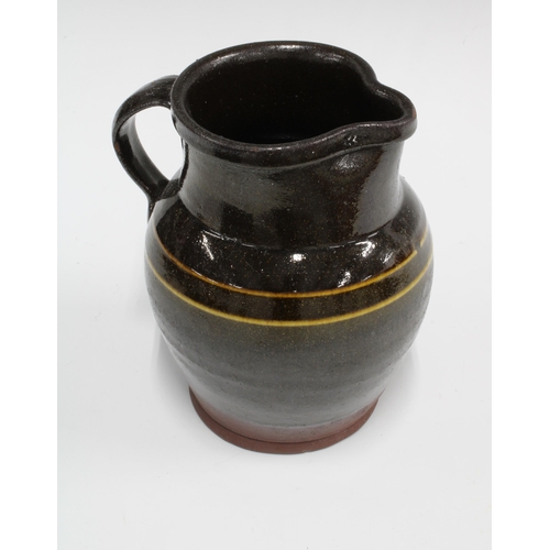 139 - Art pottery slipware jug, 18 x 17cm.