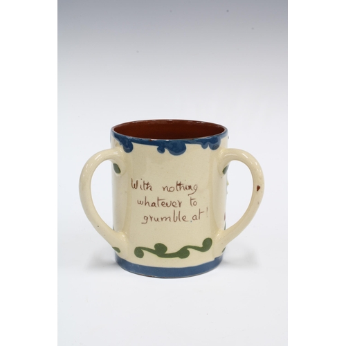 140 - Torquay Ware Scandy pattern motto loving cup, inscribed Isn't your life extremely flat.  Without wha... 