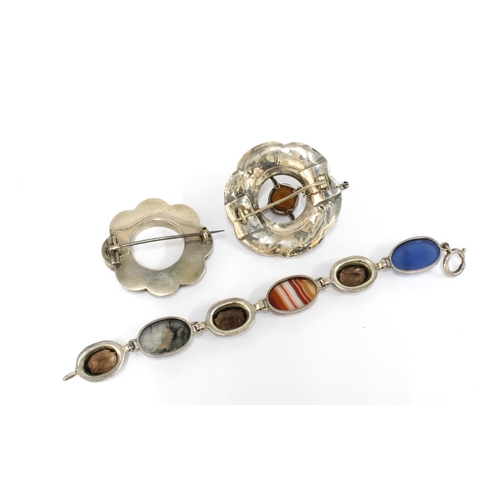 16 - A collection of Scottish coloured hardstone jewellery to include two brooches and a bracelet, stampe... 
