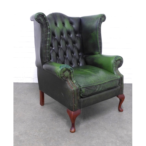 202 - Green button back wing armchair, 92 x 104 x 57cm. (upholstery a/f)