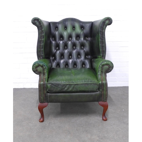 202 - Green button back wing armchair, 92 x 104 x 57cm. (upholstery a/f)