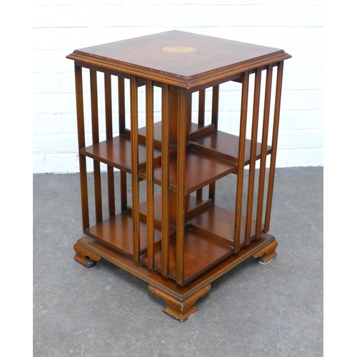 206 - Yew wood revolving bookcase of small proportions, the square top with a satinwood paterea, 40 x 60cm... 