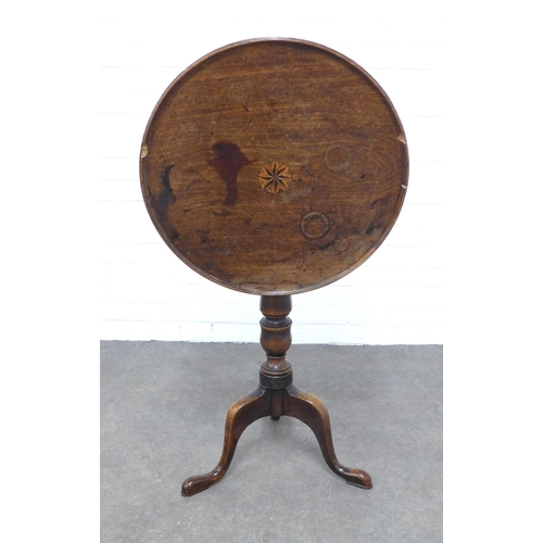 216 - Mahogany tilt top table of small proportions, with a circular dished top with inlaid motif to centre... 