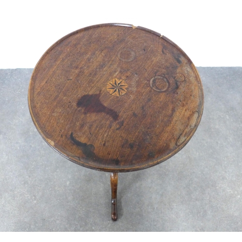 216 - Mahogany tilt top table of small proportions, with a circular dished top with inlaid motif to centre... 