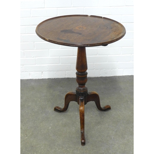 216 - Mahogany tilt top table of small proportions, with a circular dished top with inlaid motif to centre... 