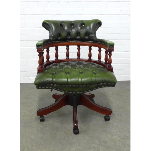 217 - Button back upholstered revolving chair, 62 x 84 x 52cm.