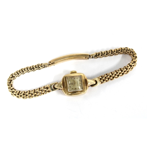 23 - 9ct gold Ladies Omega wrist watch, signed square dial, on a 9ct gold bracelet strap, stamped 375 and... 