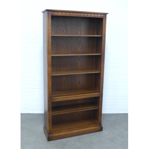 236 - An Ercol elm open bookcase, 97 x 197 x 34cm.