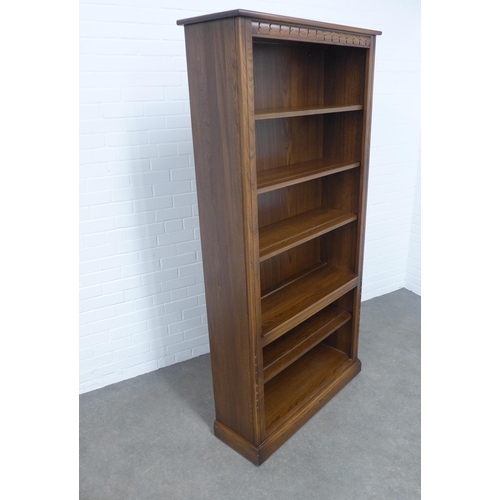 236 - An Ercol elm open bookcase, 97 x 197 x 34cm.