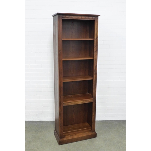 237 - An Ercol elm open bookcase, 65 x 197 x 34cm.