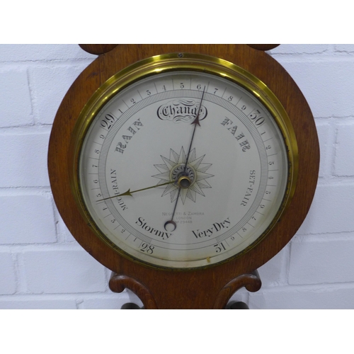 247 - An oak cased Negretti & Zambra, London NO.24448 barometer, with silvered thermometer,  28 x 86cm.