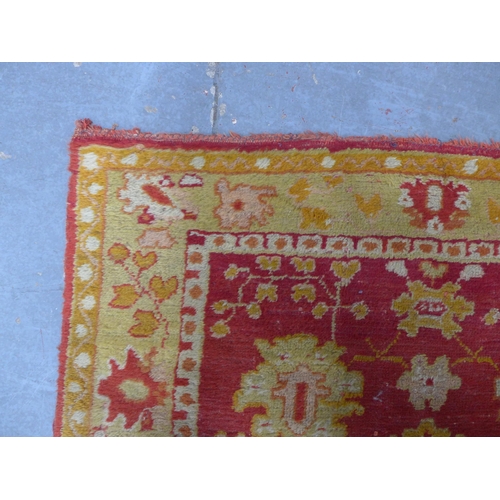 249 - Ushak runner, red field with foliate pattern within an orange border, 265 x 95cm.