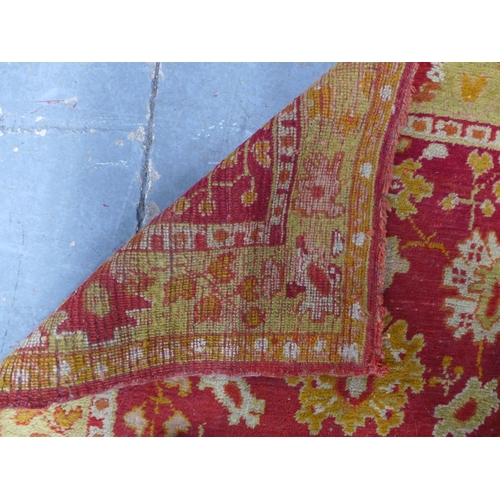 249 - Ushak runner, red field with foliate pattern within an orange border, 265 x 95cm.