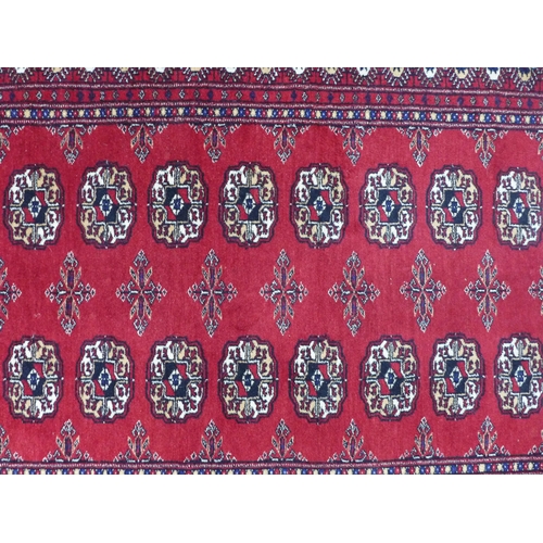 250 - Pakistan Bokhara rug with red field, 170 x 95cm.