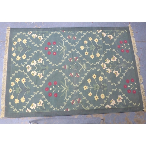 265 - A pale green flatweave rug with foliate pattern, 235 x 162cm.