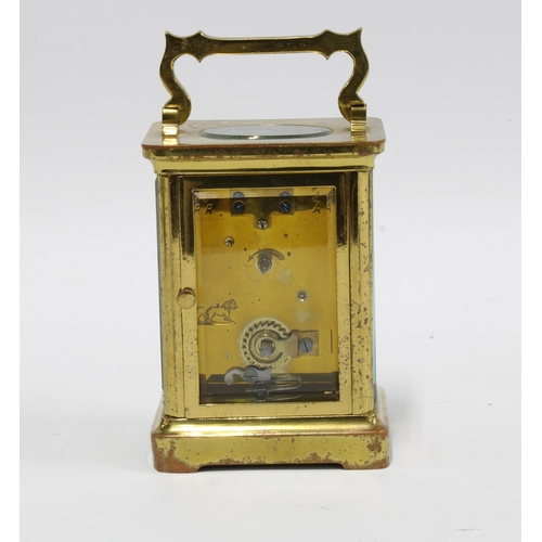 277 - A small brass and glass cased carriage clock, 14cm