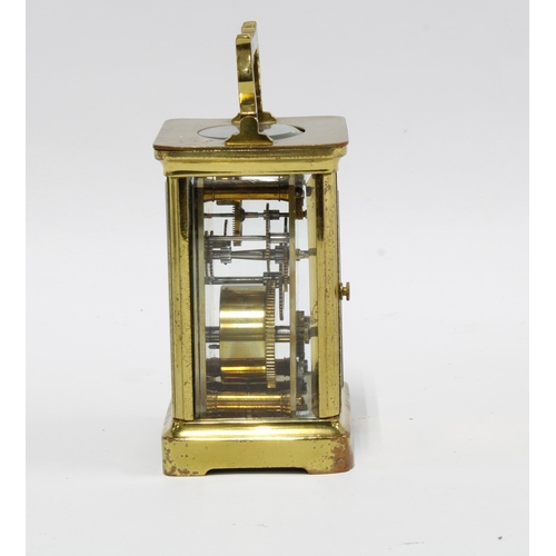 277 - A small brass and glass cased carriage clock, 14cm