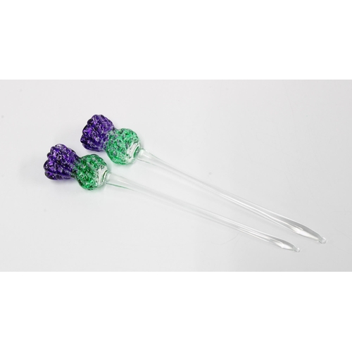 278 - Two coloured art glass swizzle sticks, in the form of thistles  14cm (2)