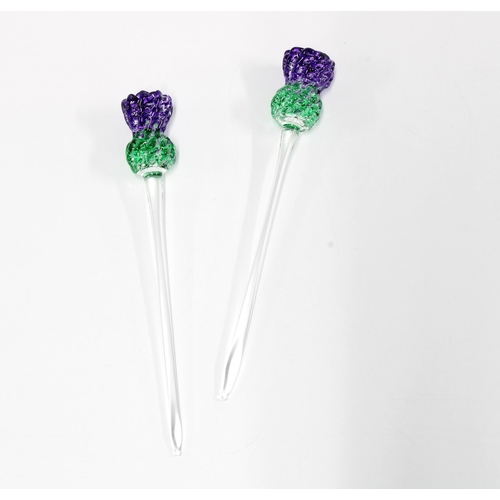 278 - Two coloured art glass swizzle sticks, in the form of thistles  14cm (2)