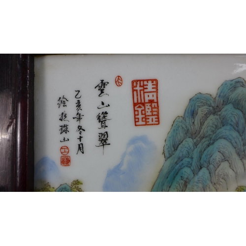 320 - Chinoiserie porcelain plaque with red seal marks, in a stylised rectangular frame, 25 x 35cm