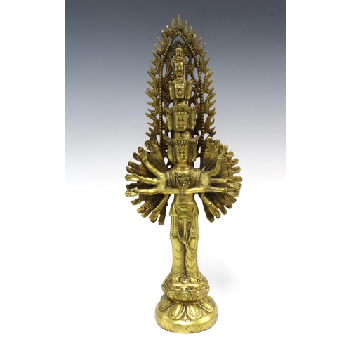 384 - Gilt bronze figure of Ekadasamukha, 34cm