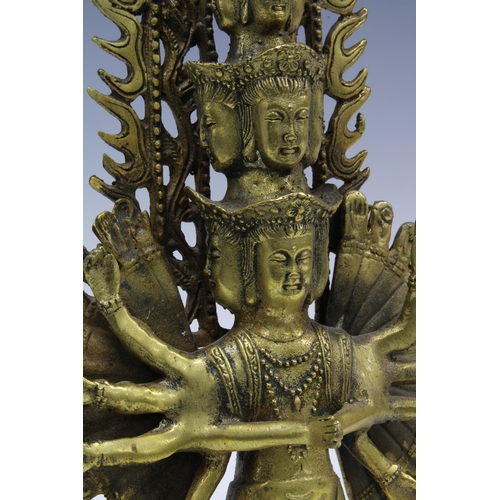 384 - Gilt bronze figure of Ekadasamukha, 34cm