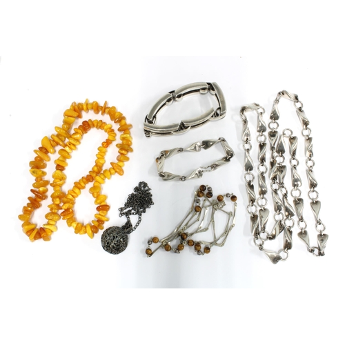 39 - Amber beads, a silver and amber chain necklace, Modernist necklace and matching bracelet with flatte... 