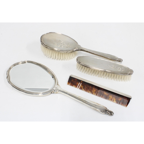 4 - A silver backed dressing table brush set, Birmingham 1960, coorising hand mirror, hair brush, clothe... 