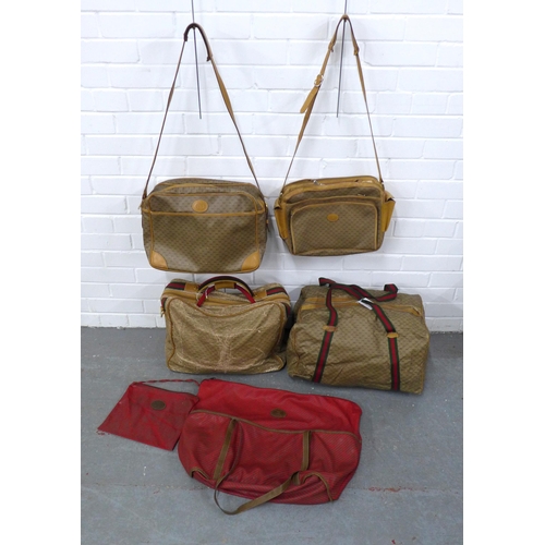 408 - A collection of vintage Gucci monogrammed weekend travel bags together with a vintage Gucci tote sho... 