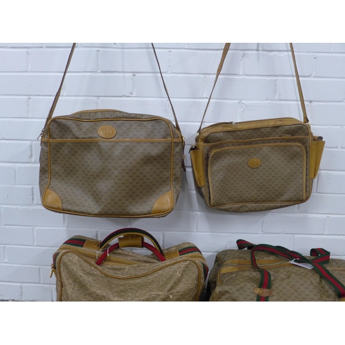 408 - A collection of vintage Gucci monogrammed weekend travel bags together with a vintage Gucci tote sho... 