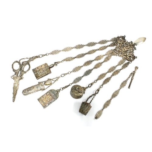 41 - A silver plated chatelaine with six ornate hanging chains with accessories together with one loose c... 