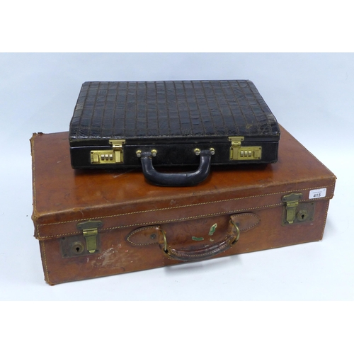 415 - Vintage brown leather travel case and a black leather briefcase,  largest 61 x 36cm (2)