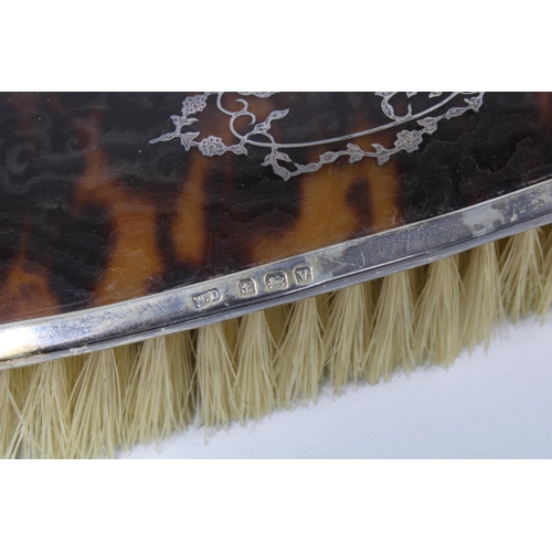 43 - George VI silver and tortoiseshell brush set, with hand mirror, two hair brushes and one clothes bru... 