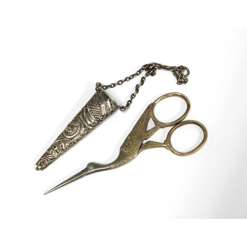 46 - An Edwardian silver chatelaine case, Chester 1903, containing a pair of 'stork' scissors (2)