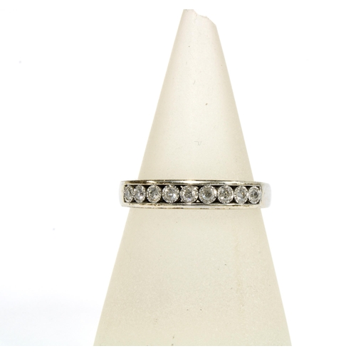 57 - 9ct white gold & diamond eternity ring