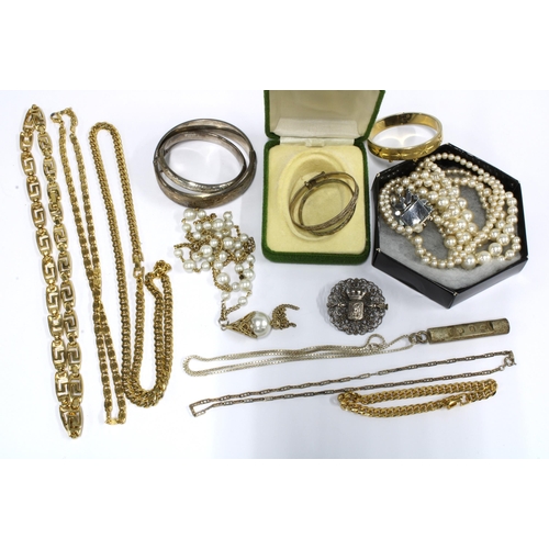 59 - A vintage silver pendant, silver baby bangles, and a collection of costume jewellery to include gilt... 