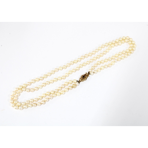 6 - Double strand pearl necklace with a 9ct gold sapphire and seed pearl clasp, Birmingham 1975